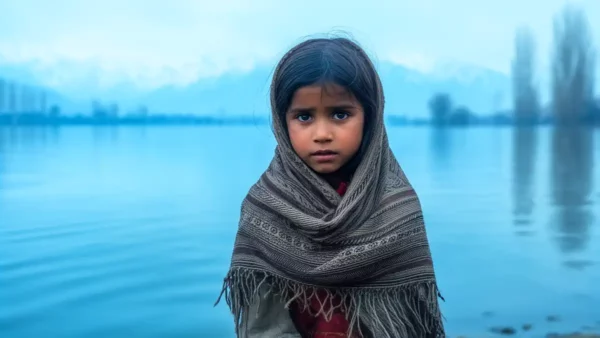 Indian girl freezing near Dal lake